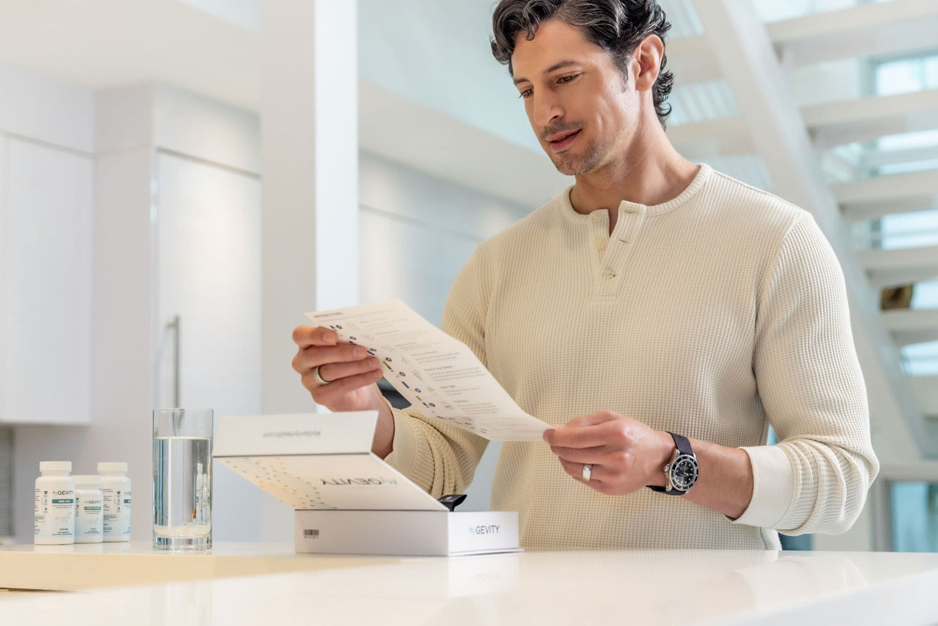 Man reading instructions for MyGevity test kit