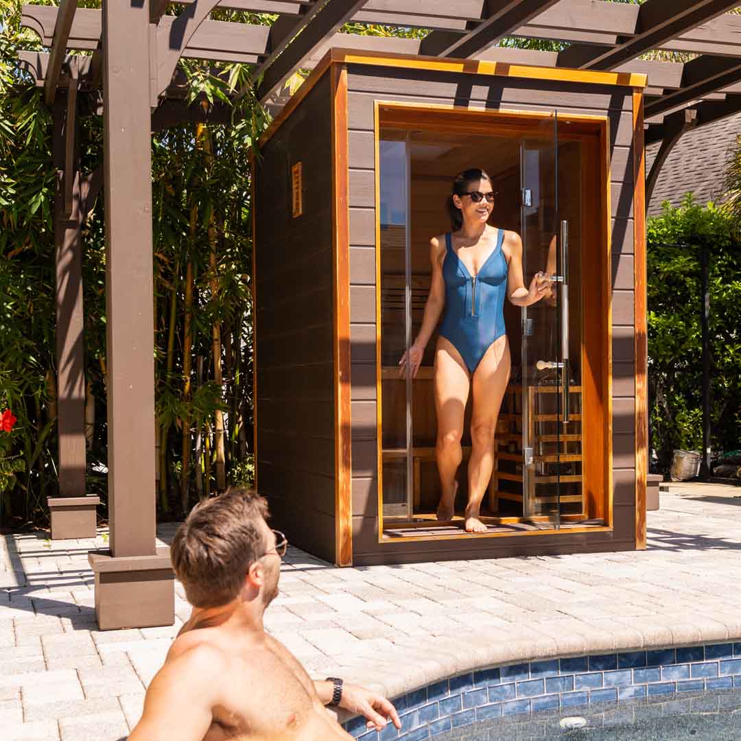 Couple poolside with sauna 