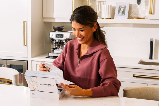 Woman reading DNA Testing Kit Directions