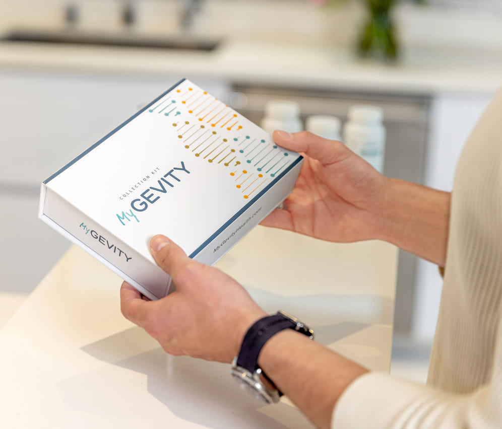 Person holding MyGevity test kit